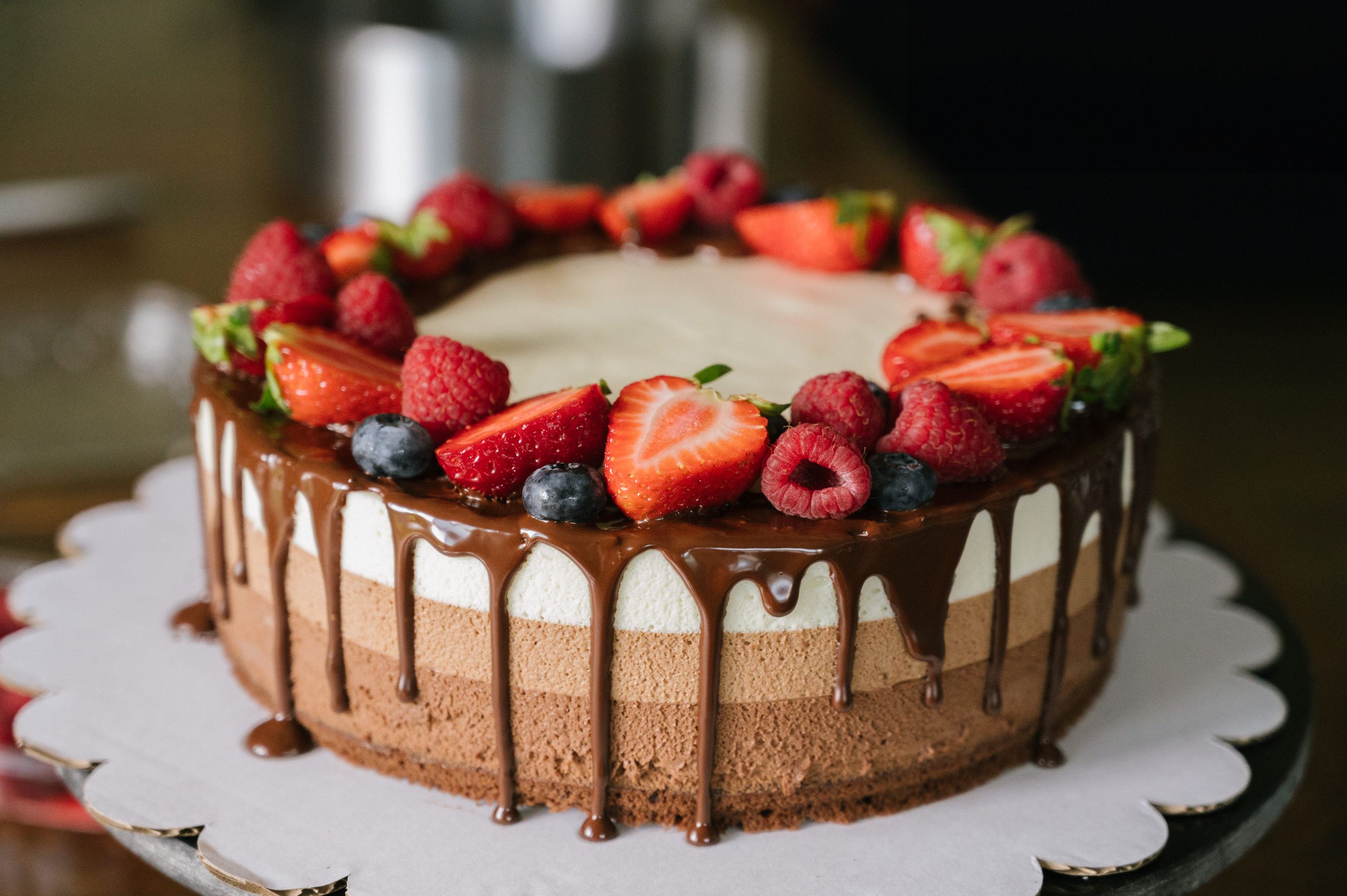 Strawberry drip cake with berries